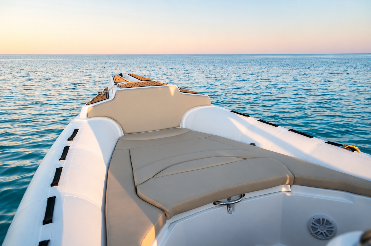 Front sunbed of the Promarine X900 with a calm Red Sea horizon at sunset