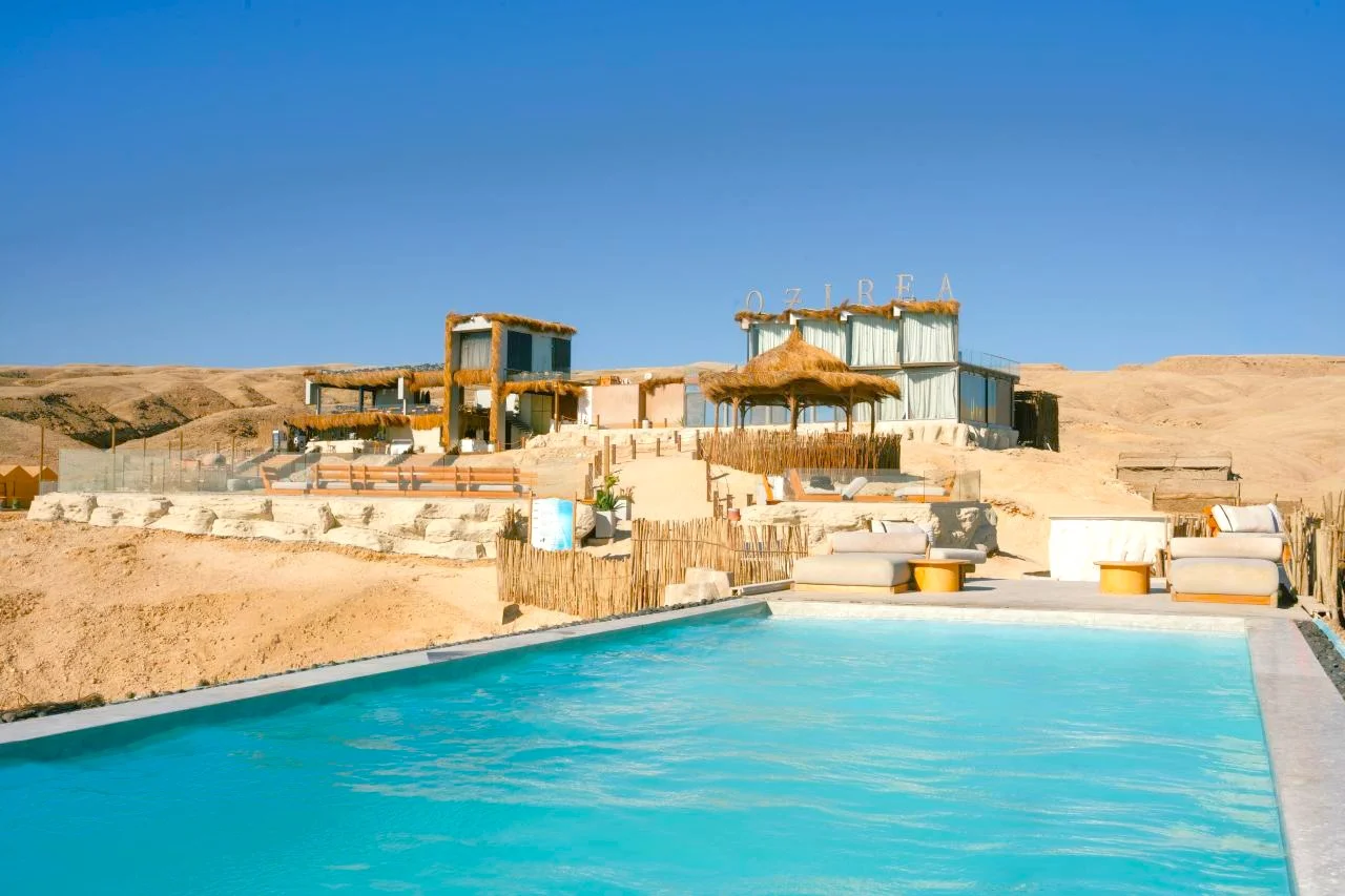 OZIREA infinity pool with the OZIREA building and sign in the background