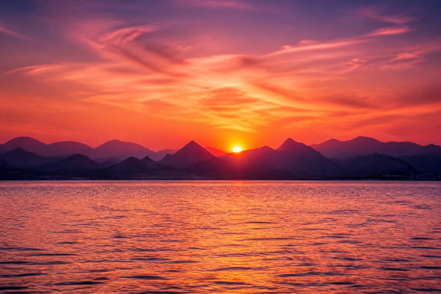 Wide sunset horizon over calm Red Sea water